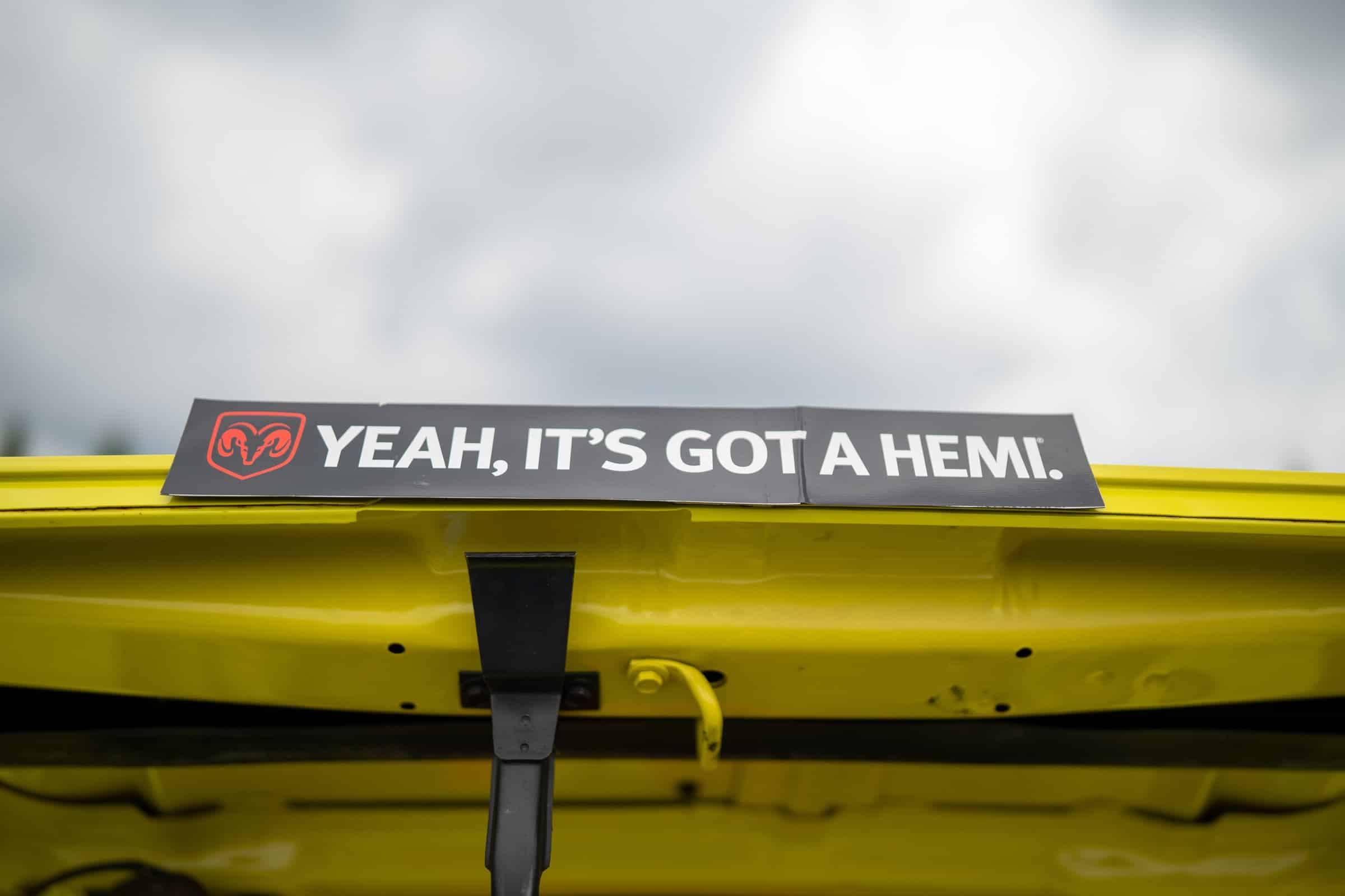 Placard on the cowl of a yellow Mopar